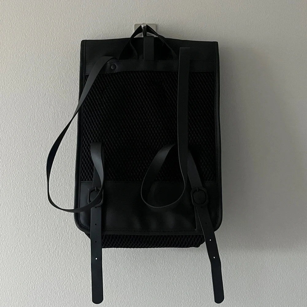 Rains Black Mesh Roll top Backpack